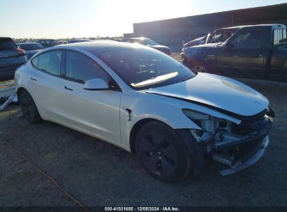 Photo TESLA model 3 standard range plus rear-wheel drive.
